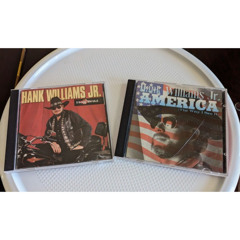 Bundle of two (2) Hank Williams Jr. Cd's (Hog Wild, America The Way I See It)